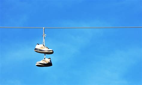 tennis shoes on wire meaning.